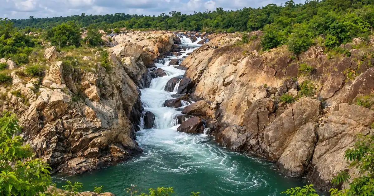 Baitarani River cascading through pale sculpted granite rocks at Bhimkund in Keonjhar