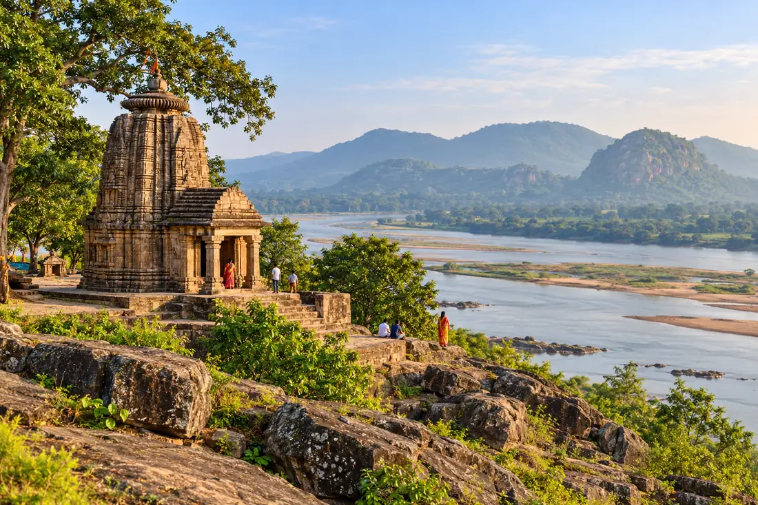 A temple stands on the rocky Mahanadi riverbank at Bhattarika