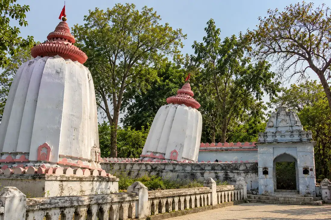 Two white temple towers with different tilts at the Huma shrine complex