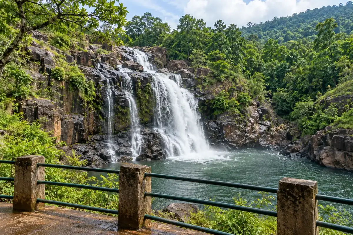 Sanaghagara Waterfall and a safe viewing rail among forest